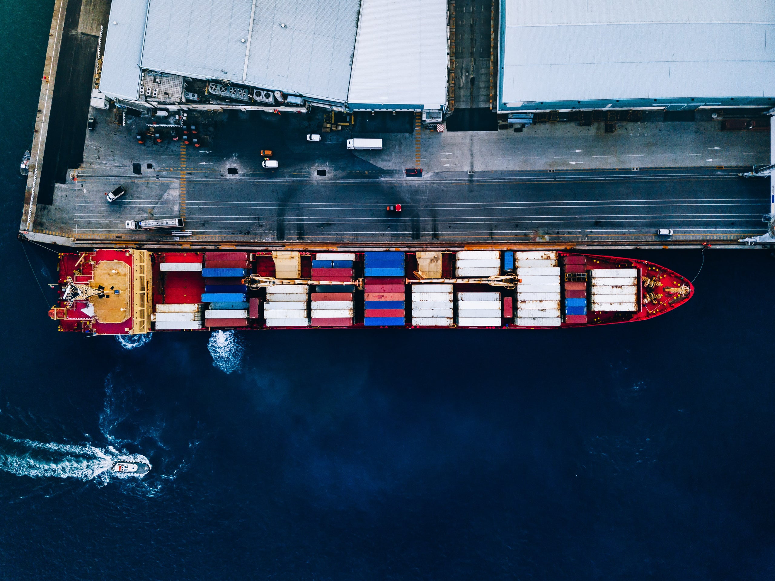 Birdseye view of a red container ship used to transport chemicals